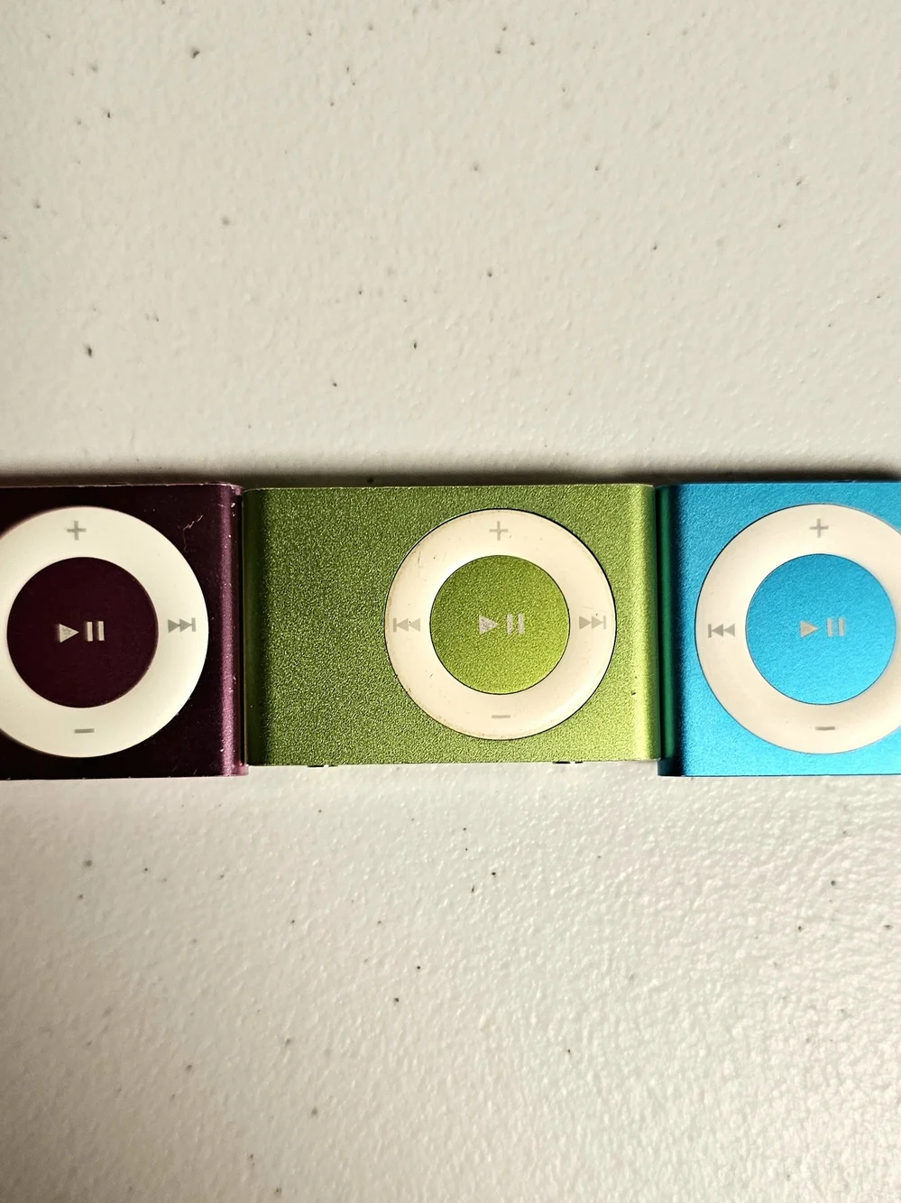 3 iPod shuffles (two 4th gens, one 2nd gen) pink, green, blue